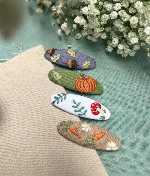 Autumn hair clip hand-embroidered with seasonal motifs on linen