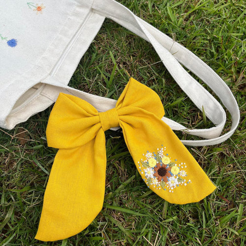 Hair bow hand-embroidered with strawberries and mushrooms on linen
