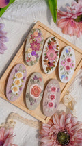 Hand-embroidered flower barrette, close view of the stitching