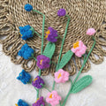 Handmade crochet wildflower stems, close view