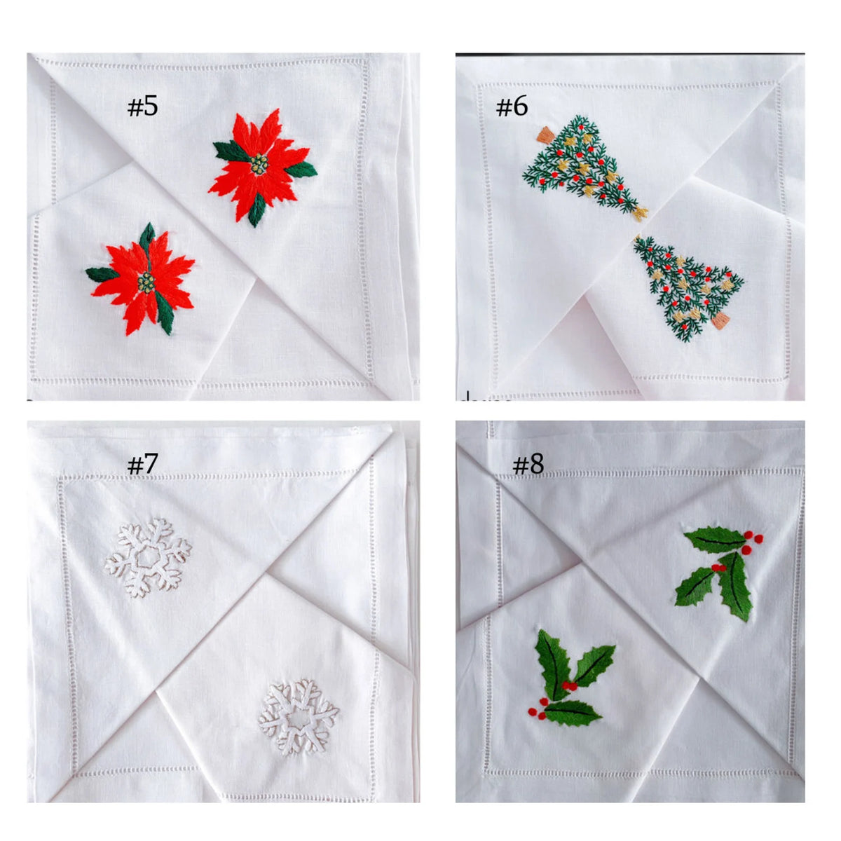 Four white linen napkins, each with a different embroidered Christmas design — hand-embroidered by The Thread Nest