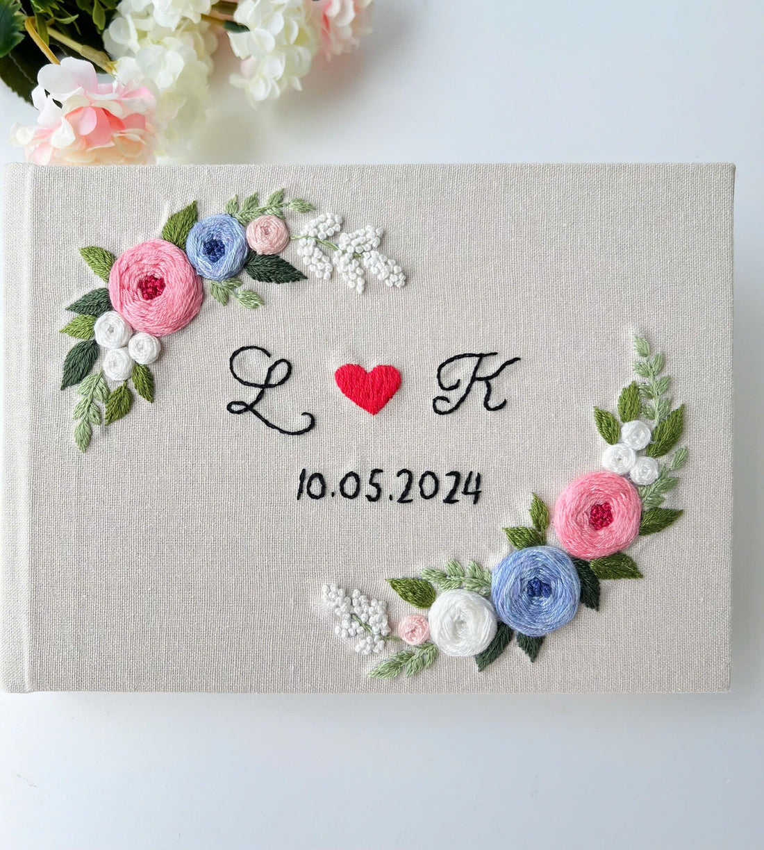 Monogram Wreath Guest Book by The Thread Nest, hand-embroidered linen cover, photo 1