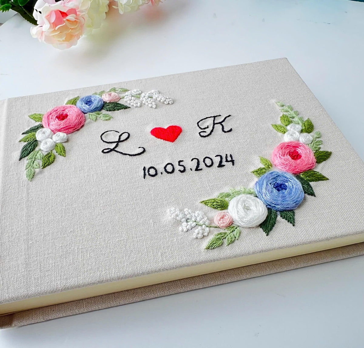 Monogram Wreath Guest Book by The Thread Nest, hand-embroidered linen cover, photo 4