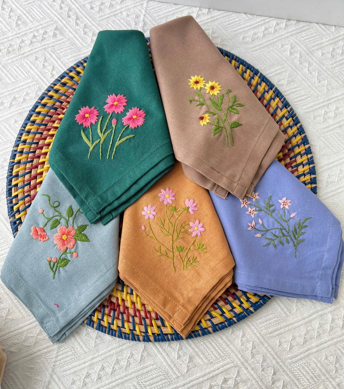 Set of six embroidered linen napkins with floral designs — hand-embroidered by The Thread Nest