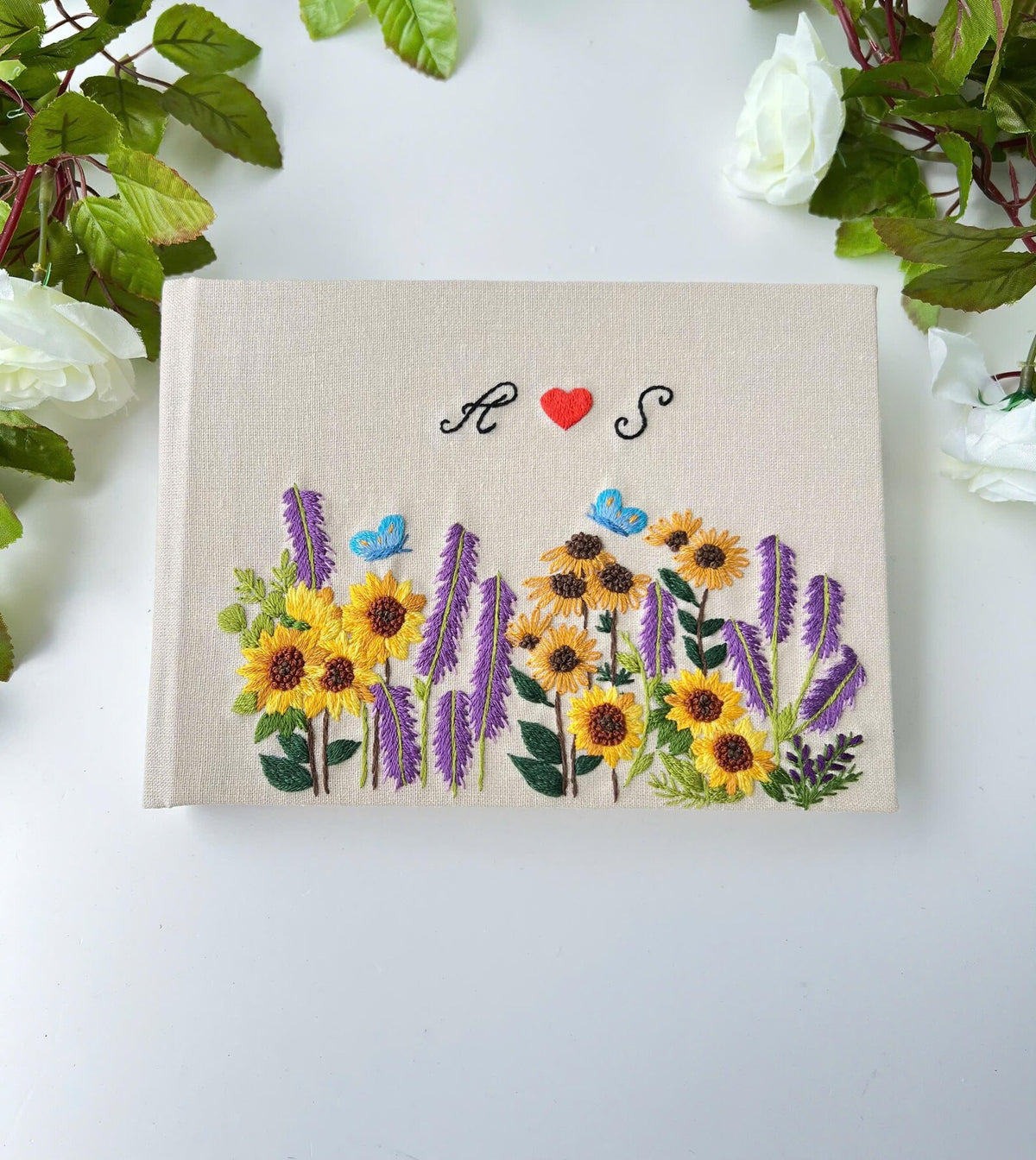 Sunflower & Lavender Guest Book with Initials by The Thread Nest, hand-embroidered linen cover, photo 1