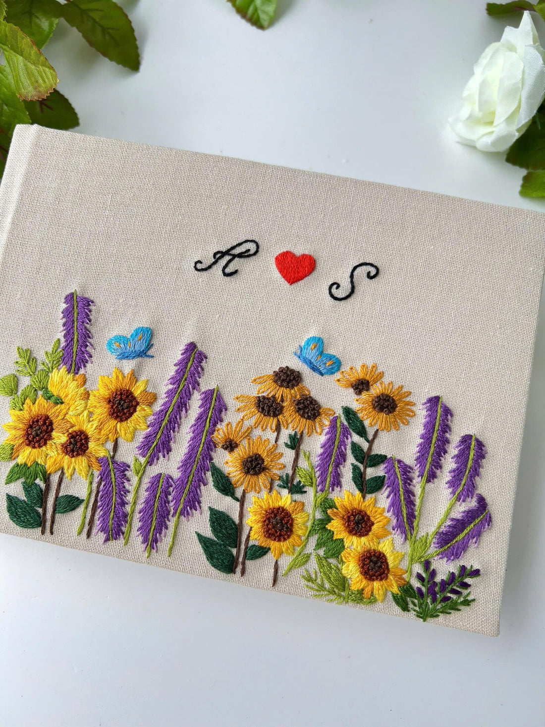 Sunflower & Lavender Guest Book with Initials by The Thread Nest, hand-embroidered linen cover, photo 1