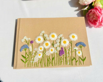 Daisy Meadow Guest Book by The Thread Nest, hand-embroidered linen cover, photo 1