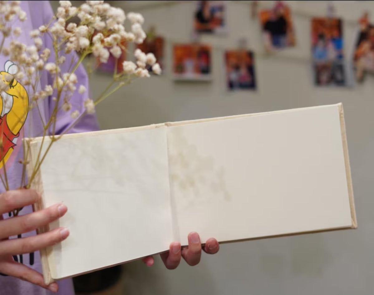 An open guest book showing the blank pages inside