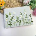 White Daisy Guest Book, Personalised by The Thread Nest, hand-embroidered linen cover, photo 3