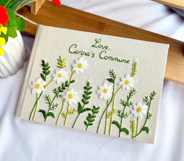 White Daisy Guest Book, Personalised by The Thread Nest, hand-embroidered linen cover, photo 1