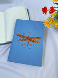 Dragonfly Embroidered Journal by The Thread Nest, pale blue linen cover with a hand-embroidered dragonfly, photo 2