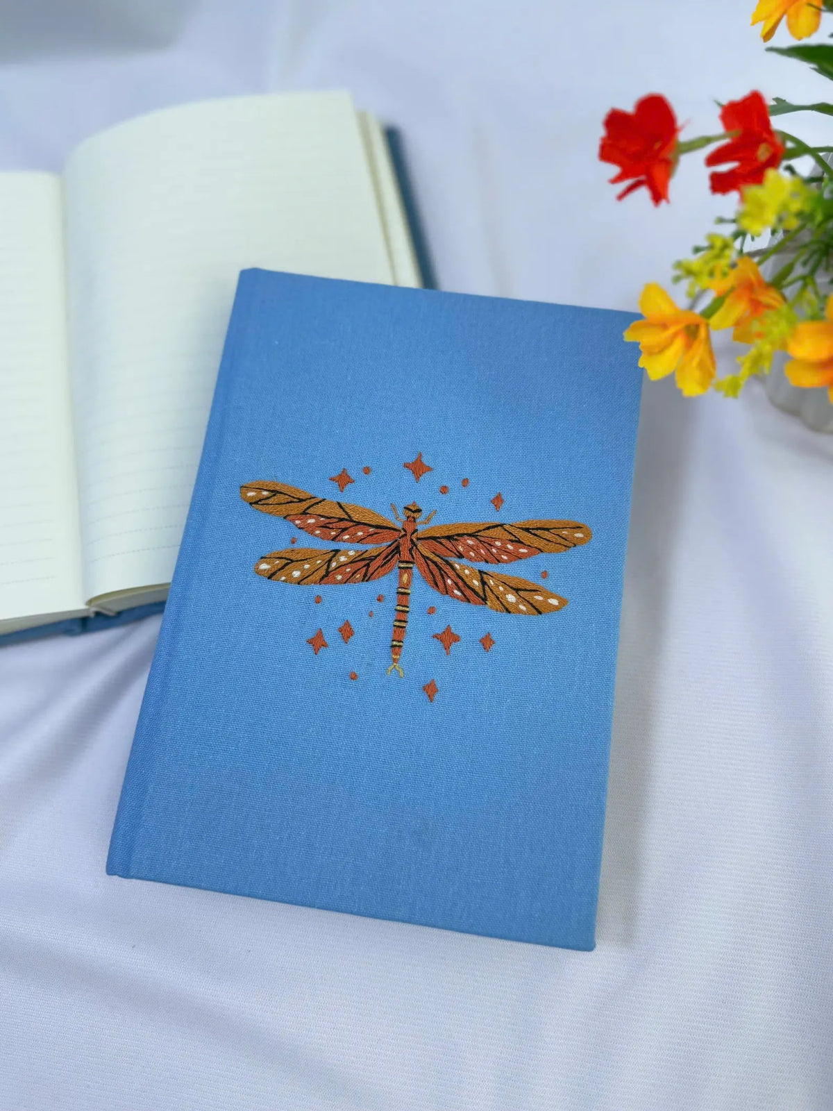 Dragonfly Embroidered Journal by The Thread Nest, pale blue linen cover with a hand-embroidered dragonfly, photo 2