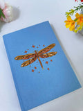 Dragonfly Embroidered Journal by The Thread Nest, pale blue linen cover with a hand-embroidered dragonfly, photo 4