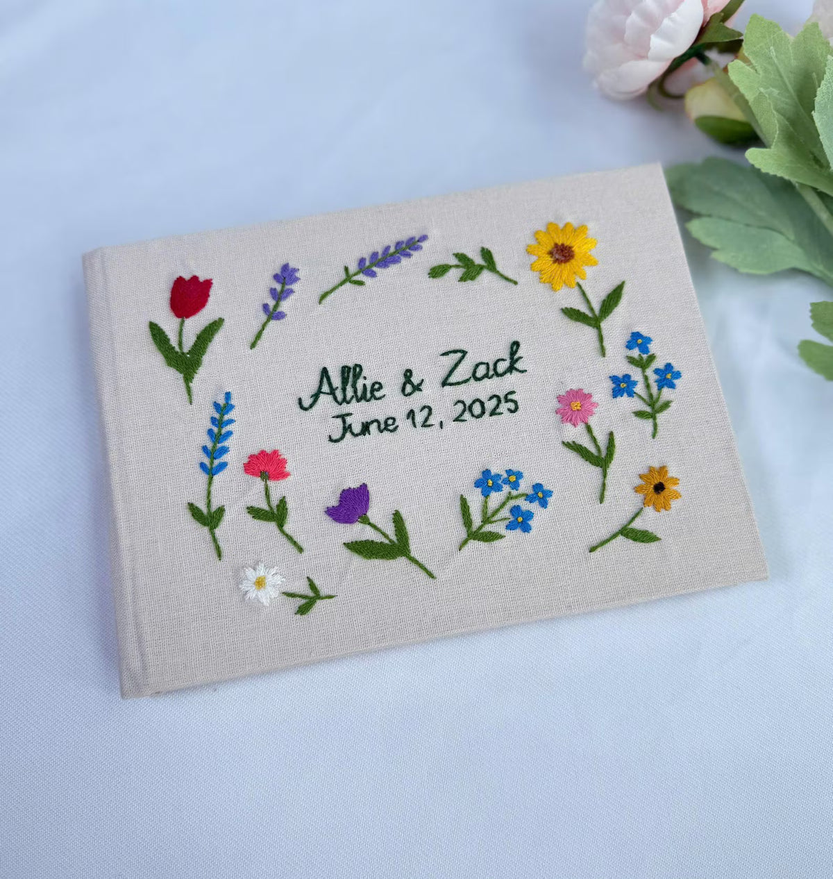 Floral Wreath Guest Book, Personalised by The Thread Nest, hand-embroidered linen cover, photo 1
