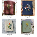 Four embroidered journals with floral designs in burgundy, navy, cream and sage — hand-embroidered by The Thread Nest