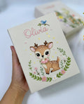 A beige keepsake box with an embroidered deer in a floral wreath — hand-embroidered by The Thread Nest