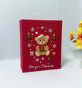 A red keepsake box with an embroidered teddy bear in a Santa hat — hand-embroidered by The Thread Nest