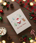 A beige Christmas book cover with an embroidered Santa, reindeer and trees — hand-embroidered by The Thread Nest