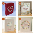 A hand-embroidered linen photo album by The Thread Nest