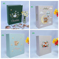 Four personalized photo albums with embroidered animals — hand-embroidered by The Thread Nest