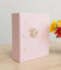 A light pink keepsake box with an embroidered squirrel holding flowers — hand-embroidered by The Thread Nest