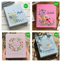 Four photo albums with embroidered flowers and names — hand-embroidered by The Thread Nest