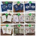A selection of embroidered vow book designs shown together