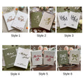Six pairs of vow books in different fabrics and lettering styles