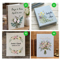 Four photo albums with embroidered floral designs, names and dates — hand-embroidered by The Thread Nest