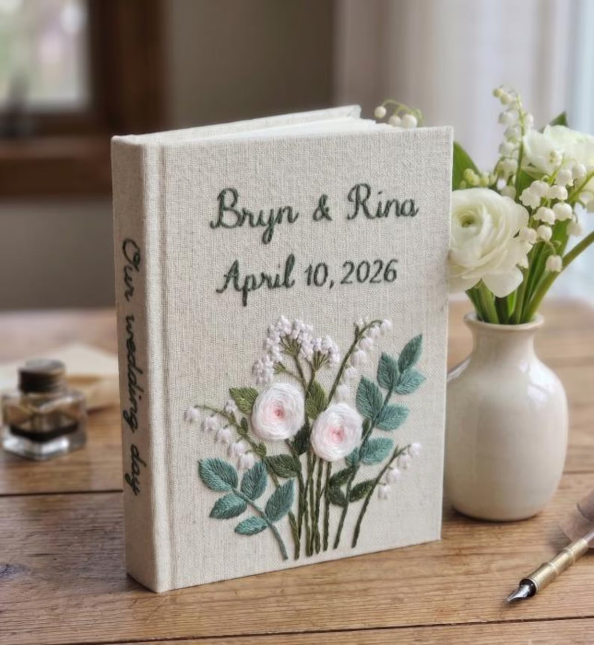 A hand-embroidered linen wedding photo album by The Thread Nest